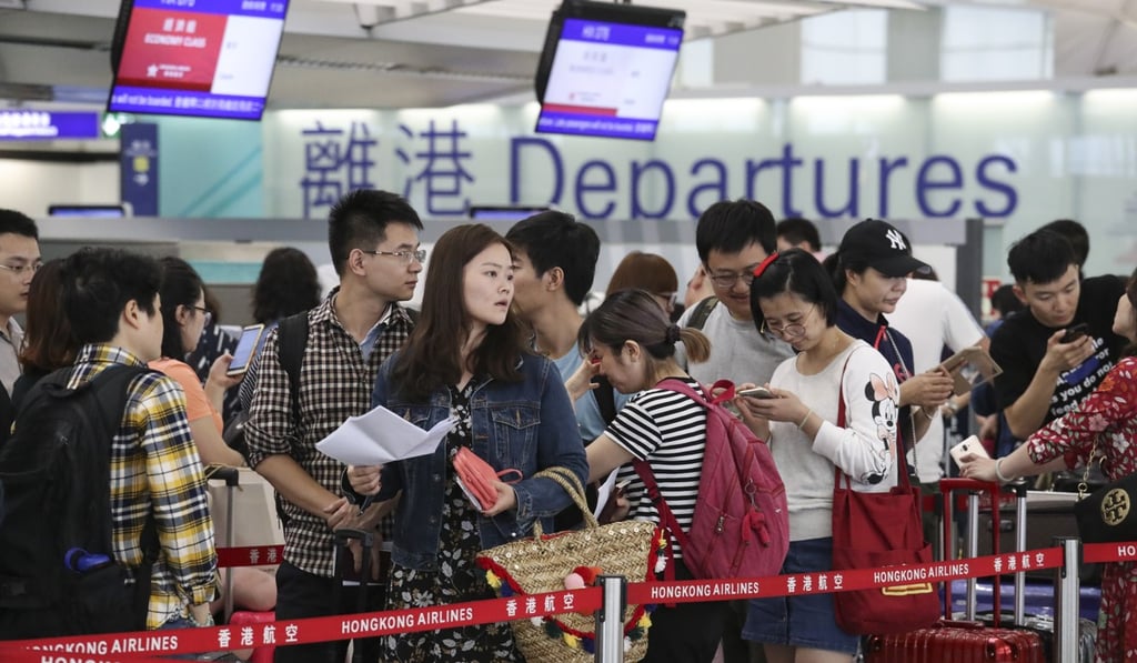 Passengers in the departure hall at Hong Kong International Airport last month. (May) Photo. Nora Tam