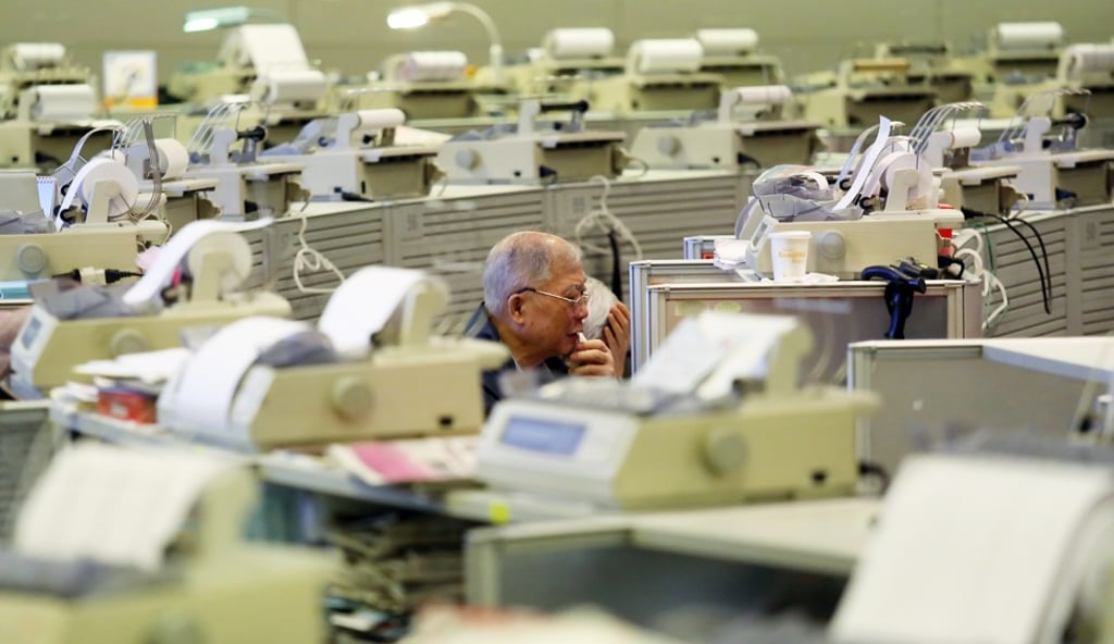 Floor traders are seen at the Hong Kong stock exchange in Central. Photo: SCMP