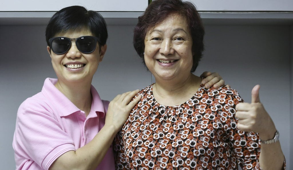Client Fion Lam (right) with her masseuse Chan Chat-fung. Photo: Jonathan Wong