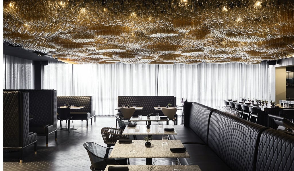 A chandelier by Jan Flook covers the ceiling at the Doot, Doot, Doot restaurant. A chandelier by Jan Flook covers the ceiling at the Doot, Doot, Doot restaurant.