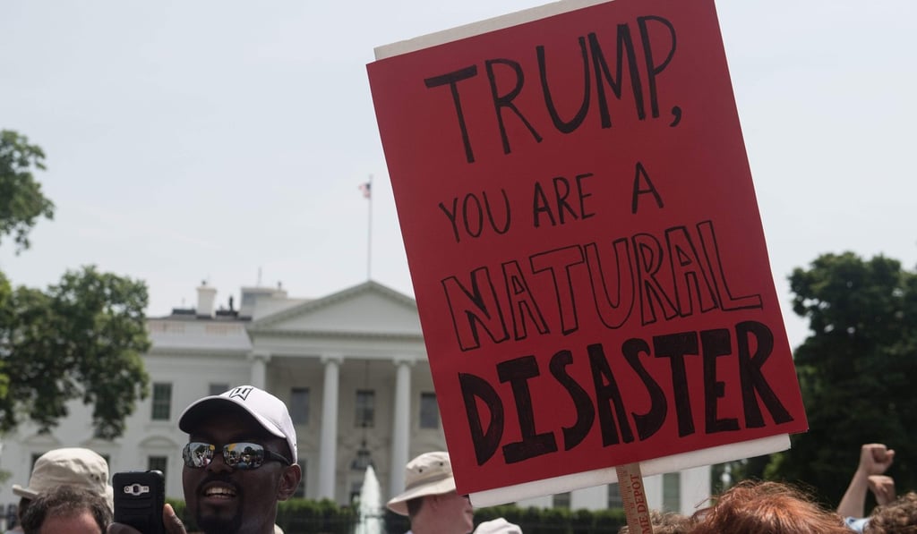 A photo taken on April 29 shows protesters in front of the White House during the People's Climate March in Washington, DC. Photo: AFP