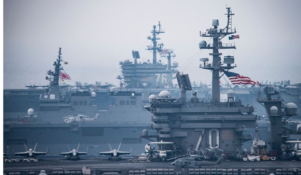 The Carl Vinson strike group, including the USS Carl Vinson, during a joint navel drill with the USS Ronald Reagan and Japanese ships off the Korean peninsula. Photo: AP The Carl Vinson strike group, including the USS Carl Vinson, during a joint navel drill with the USS Ronald Reagan and Japanese ships off the Korean peninsula. Photo: AP