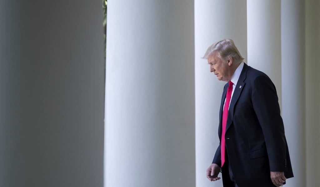 US President Donald J. Trump walks from the Oval Office to announce that the US is withdrawing from the Paris climate accord on Thursday. Photo: EPA
