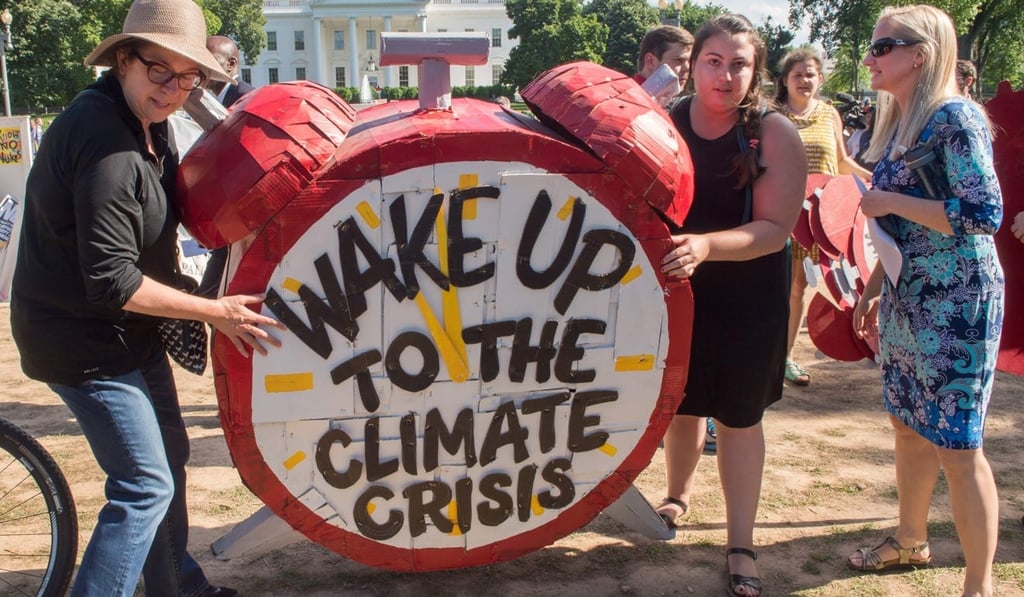 The message to the White House is loud and clear on June 1, as protesters object to US President Donald Trump’s decision to withdraw from the Paris climate accord. Photo: AFP