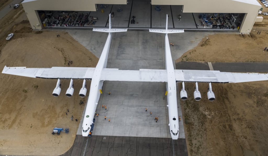 A handout photo made available on Thursday shows the Stratolaunch aircraft rolling out of its hangar for the first time ever in Mojave, California. Photo: EPA A handout photo made available on Thursday shows the Stratolaunch aircraft rolling out of its hangar for the first time ever in Mojave, California. Photo: EPA