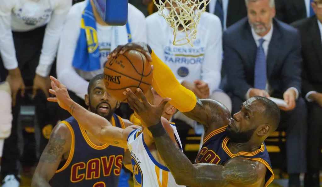 LeBron James battles for the ball with Golden State Warriors guard Stephen Curry. Photo: USA TODAY Sports
