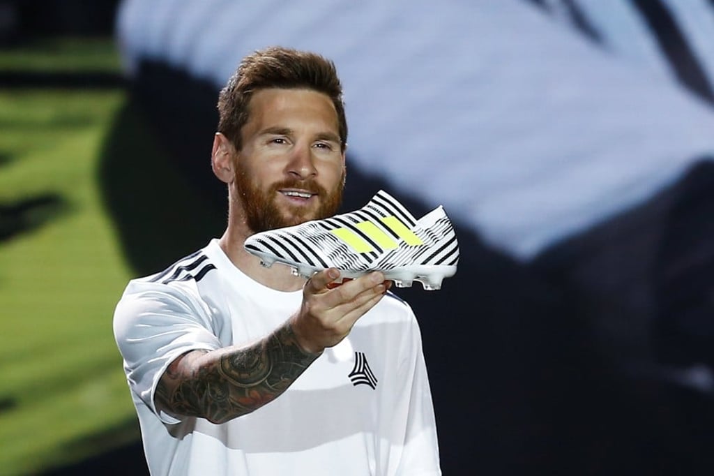 Lionel Messi presents an Adidas shoe during a show in Beijing. Photo: Reuters