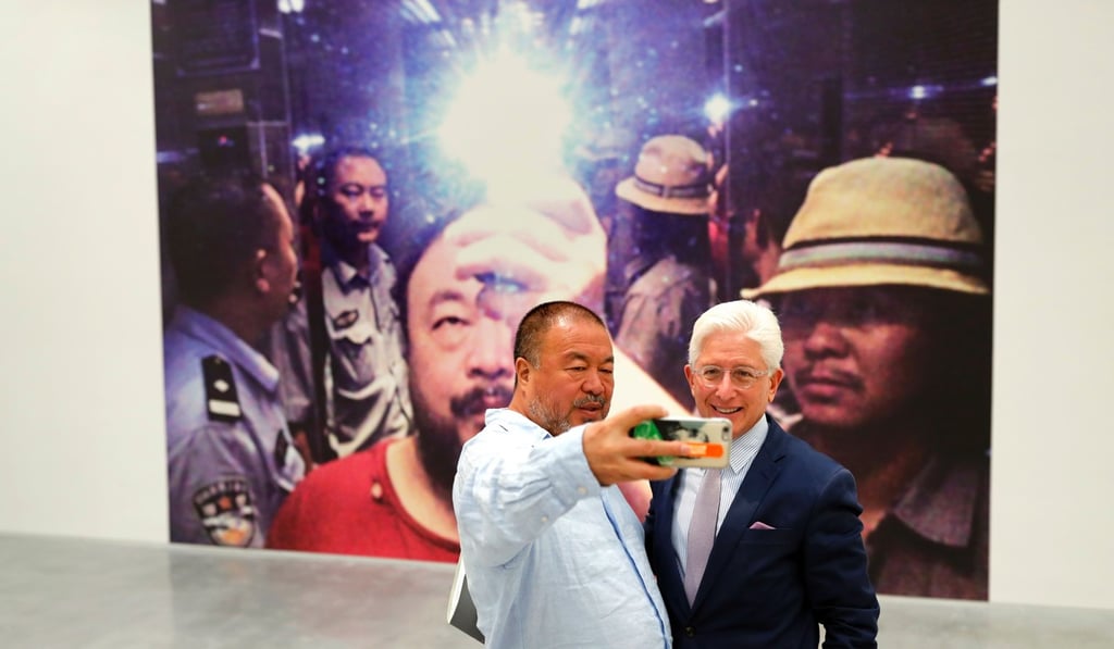 Chinese artist Ai Weiwei takes a selfie with Israel Museum director James Snyder in front of his art work “Illumination” at the Israel Museum in Jerusalem on Thursday. Photo: AFP Chinese artist Ai Weiwei takes a selfie with Israel Museum director James Snyder in front of his art work “Illumination” at the Israel Museum in Jerusalem on Thursday. Photo: AFP