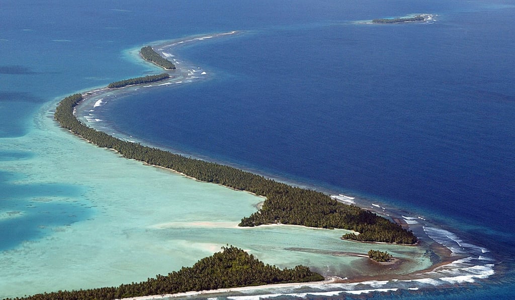 The coastline of Funafuti, an atoll of Tuvalu. The Paris agreement had brought all countries to make some commitment, from the largest emitters like China to the smallest island states. Photo: AFP The coastline of Funafuti, an atoll of Tuvalu. The Paris agreement had brought all countries to make some commitment, from the largest emitters like China to the smallest island states. Photo: AFP