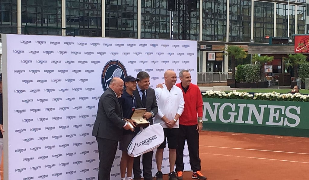 Chak Lam Coleman Wong with Andre Agassi and Alex Corretja (right). Photo: Edith Lun
