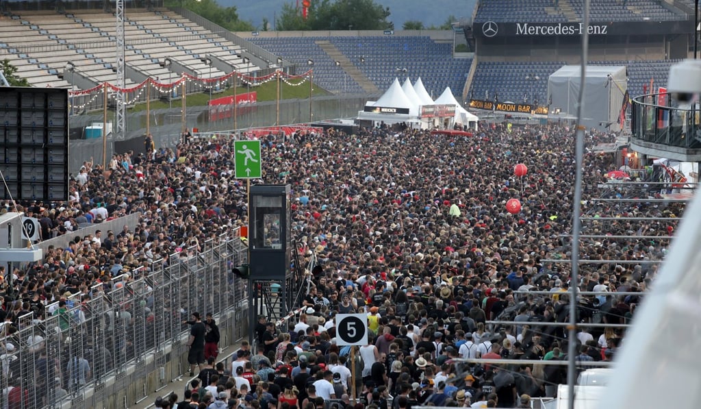 Festivalgoers leave the venue. Photo: EPA