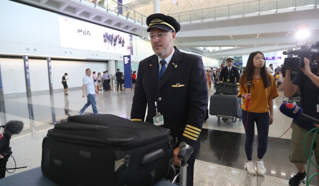 KLM cabin crew leaving Hong Kong International Airport after the incident. Photo: Edward Wong KLM cabin crew leaving Hong Kong International Airport after the incident. Photo: Edward Wong