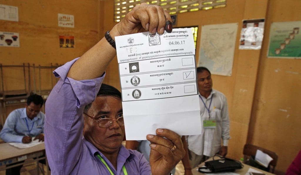 Cambodian National Election Committee (NEC) officials count ballots. Photo: EPA