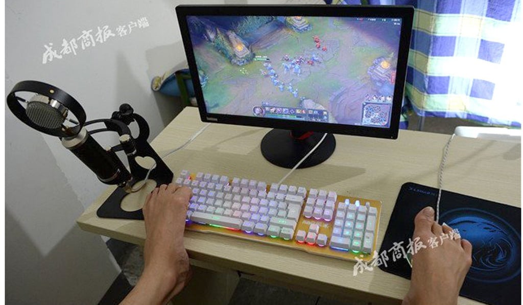 Peng operates the keyboard with his left foot and the mouse with the right. Photo: Handout