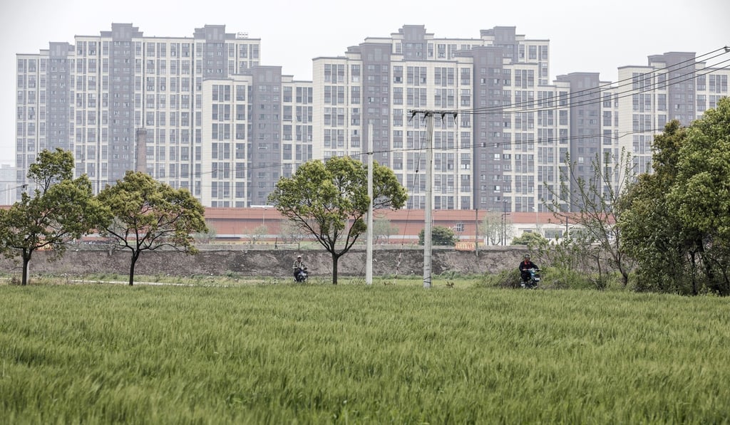 Only a dream for many: new residential buildings stand in the background on the outskirts of Shanghai. Photo: Bloomberg