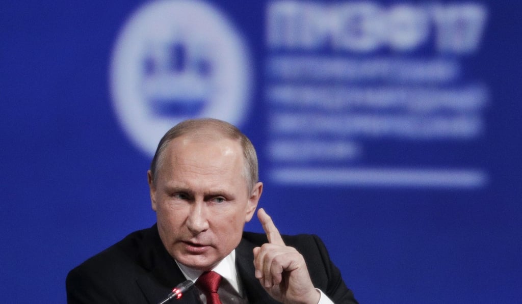 Russian President Vladimir Putin gestures as he speaks at the St Petersburg International Economic Forum on Friday. Photo: AP