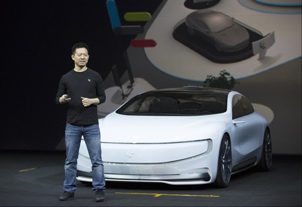 Internet entrepreneur Jia Yueting and his LeSee all-electric prototype during a ceremony in Beijing in April 2016 Photo: SCMP