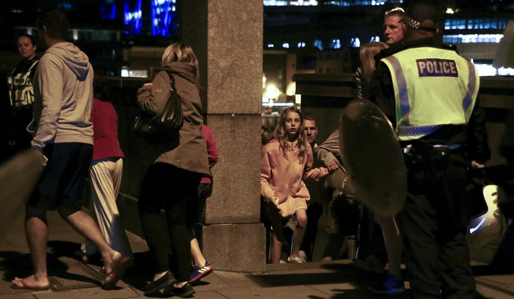 People flee as police attend the terror attack at London Bridge. Photo: Reuters