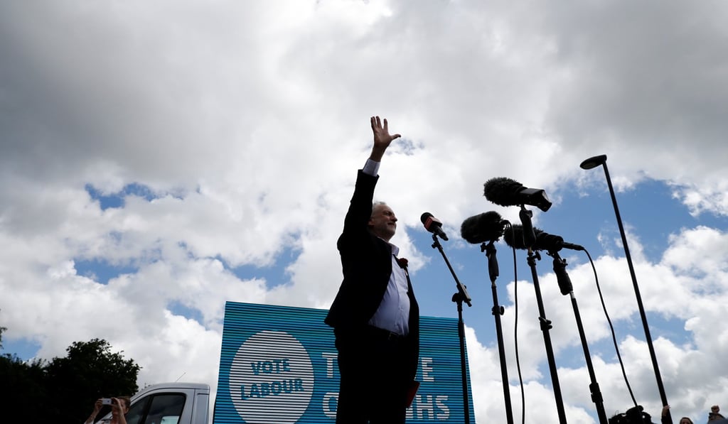 Britain's opposition Labour Party leader, Jeremy Corbyn, waves to supporters at a rally. Photo: Reuters