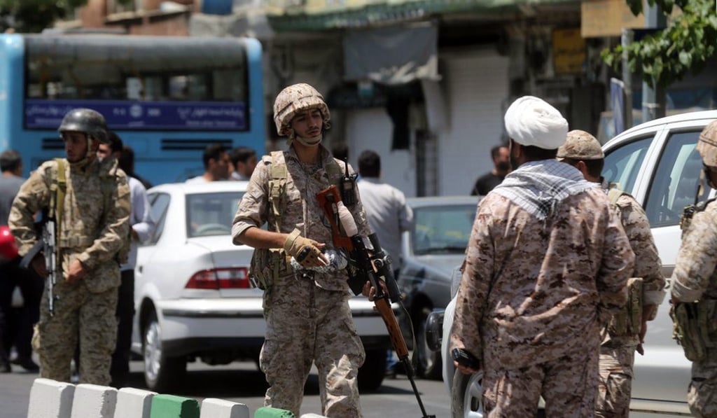 Members of the Iranian Revolutionary Guard secure the area outside the Iranian parliament. Photo: AFP Members of the Iranian Revolutionary Guard secure the area outside the Iranian parliament. Photo: AFP