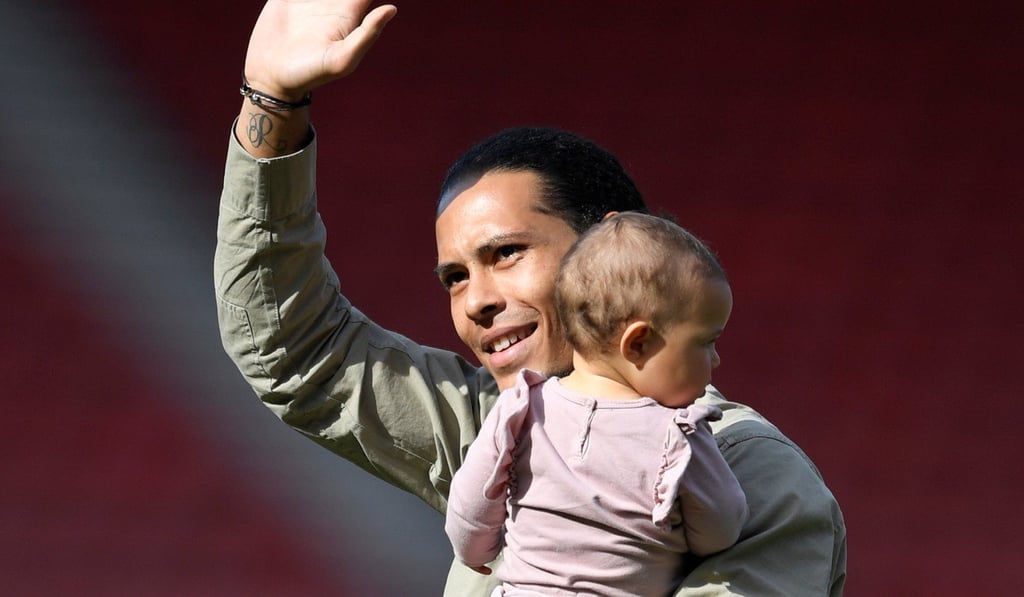 Southampton’s Virgil van Dijk with his child on the pitch at the end of their last home match. Photo: Reuters