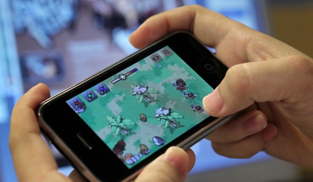 A file picture of a member of staff playing a game developed by the Hong Kong firm Celestial Digital Entertainment. Photo: Handout
