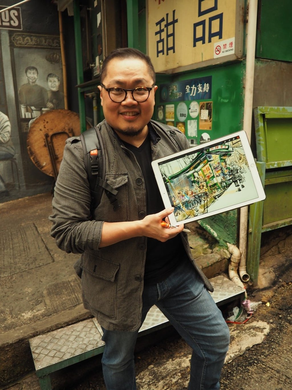Sketcherman uses his iPad to capture scenes from around the city. Photo: Lauren James
