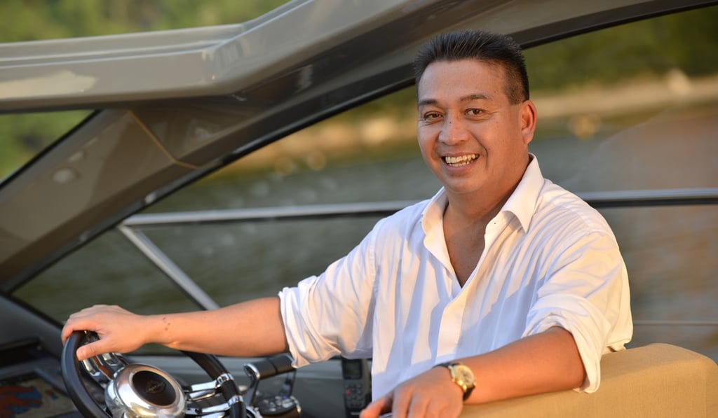 Gordon Hui, chairman of Sunseeker Asia, at the wheel in Deep Water Bay. Photo: Sunseeker