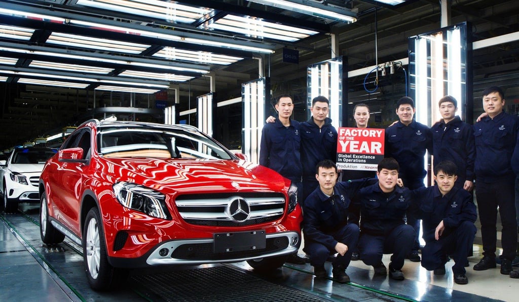 Beijing Benz Automotive employees in Beijing with the 'Factory of the Year' award. Photo: Handout
