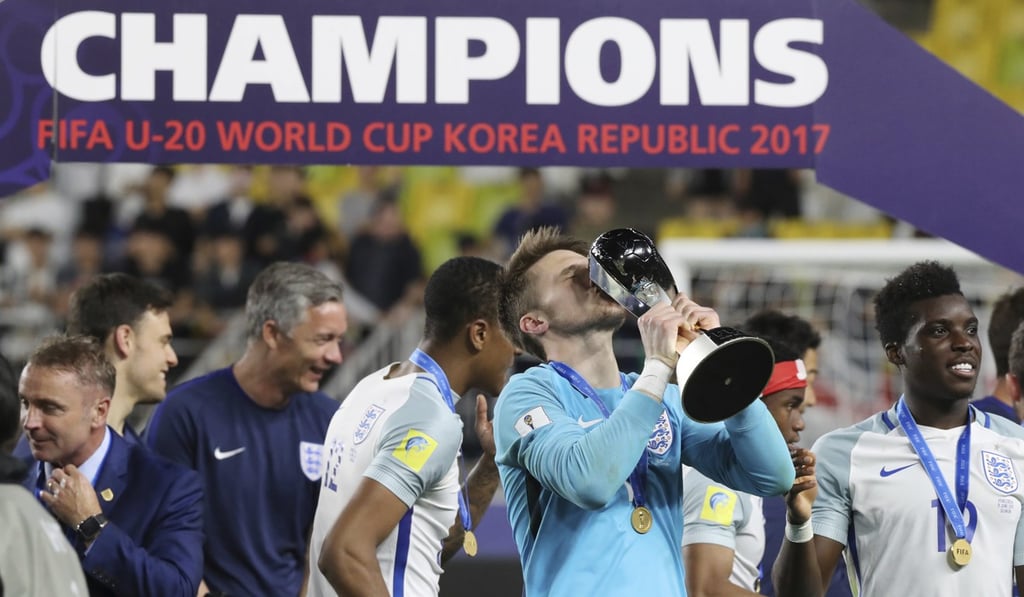 England goalkeeper Freddie Woodman kisses the trophy. Photo: AP