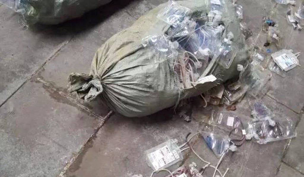 Several men were found “recycling” about 50 tonnes of used medical supplies in a backyard workshop in Gupei township in April last year. Photo: Handout