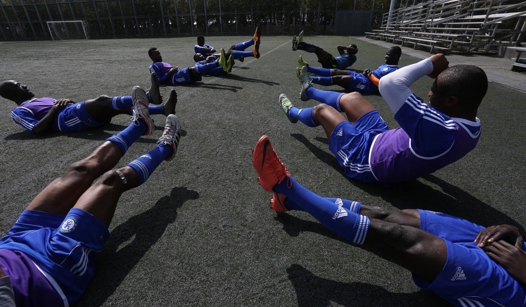 All Black FC warming up before practice. Photo: Jonathan Wong