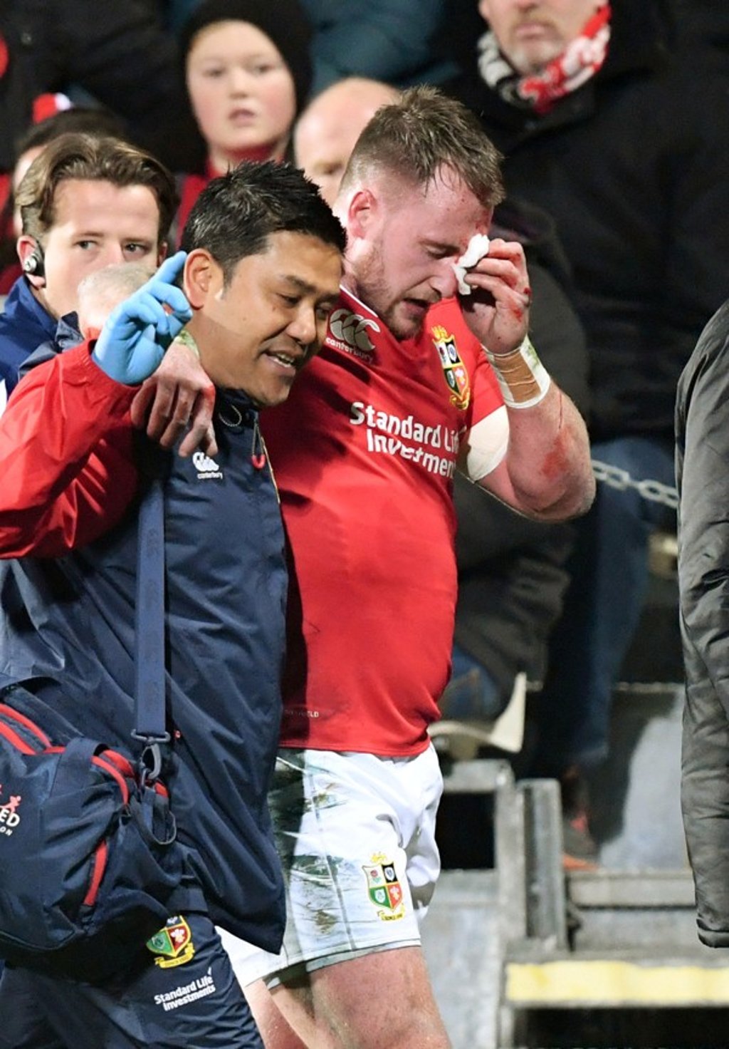 Hogg leaves the field injured after clashing with one of his own players against the Crusaders. Photo: Reuters