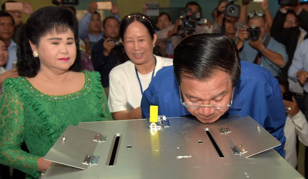 Cambodian Prime Minister Hun Sen looks into a ballot box after casting his vote at local polls this month. File photo: AFP