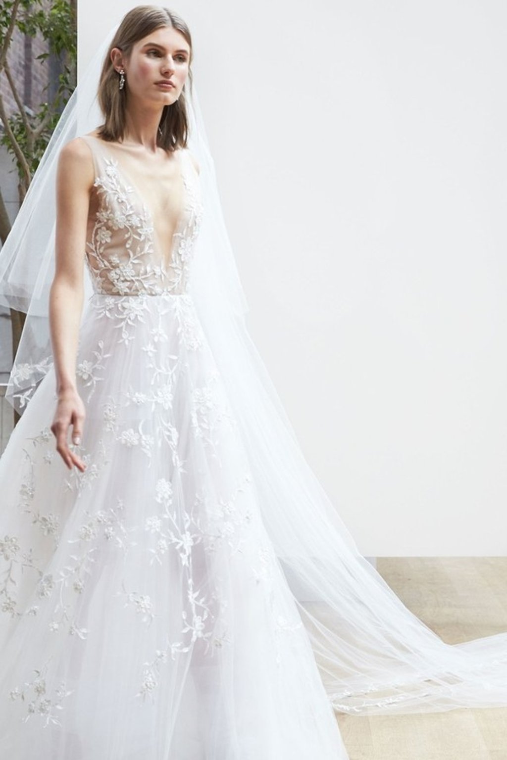 Oscar de la Renta low cut ethereal gown at Trinity Bridal