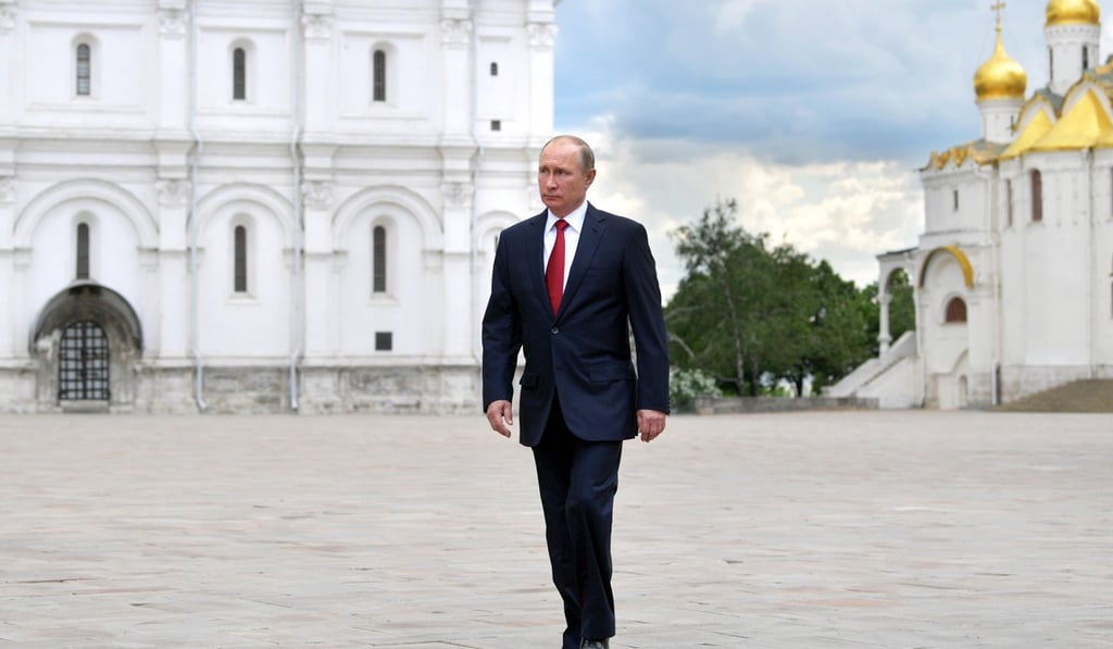 Russian President Vladimir Putin walks in the Kremlin in Moscow, Russia. Photo: Sputnik handout via EPA
