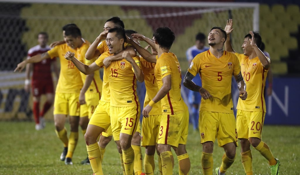 China's Wu Xi (No 15) celebrates scoring a goal against Syria in the Group A World Cup qualifying soccer match in Melaka, Malaysia, on Tuesday. Photo: AP