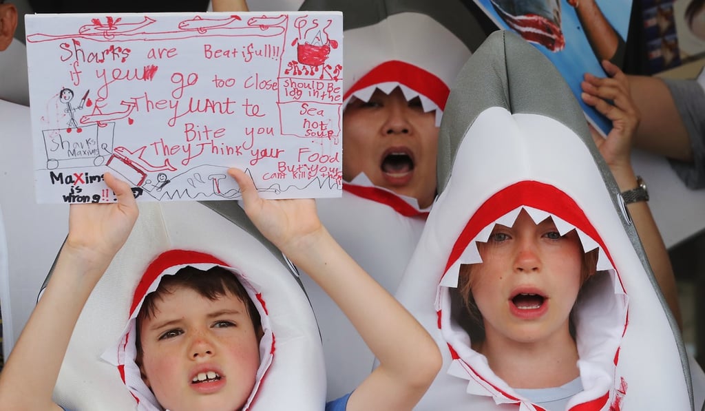 Children protest against Maxim’s for serving shark fin at its restaurants. Photo: Edward Wong