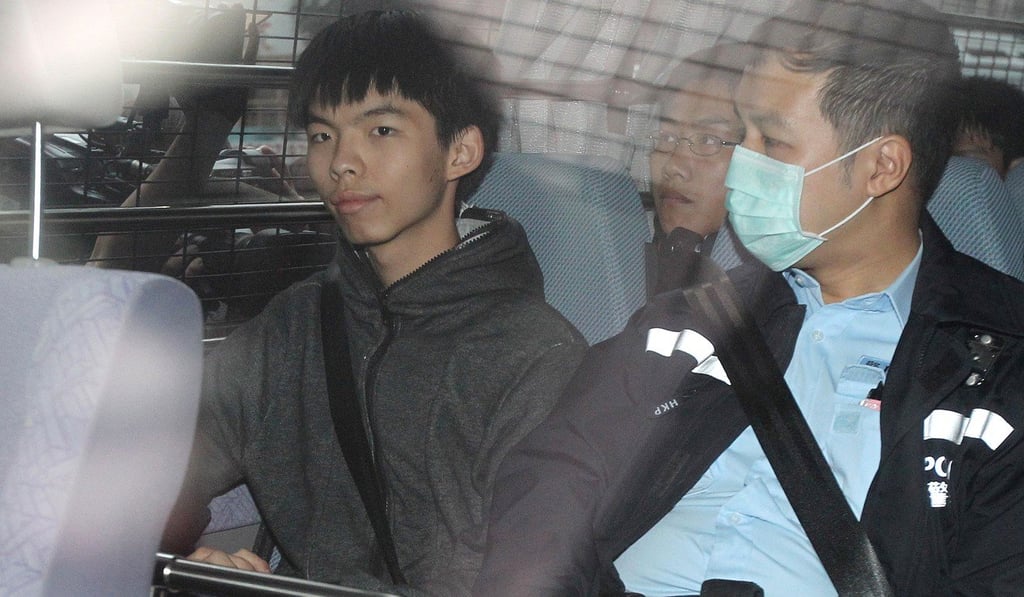 Joshua Wong Chi-fung (left) in a police van shortly after the event in question. Photo: Handout