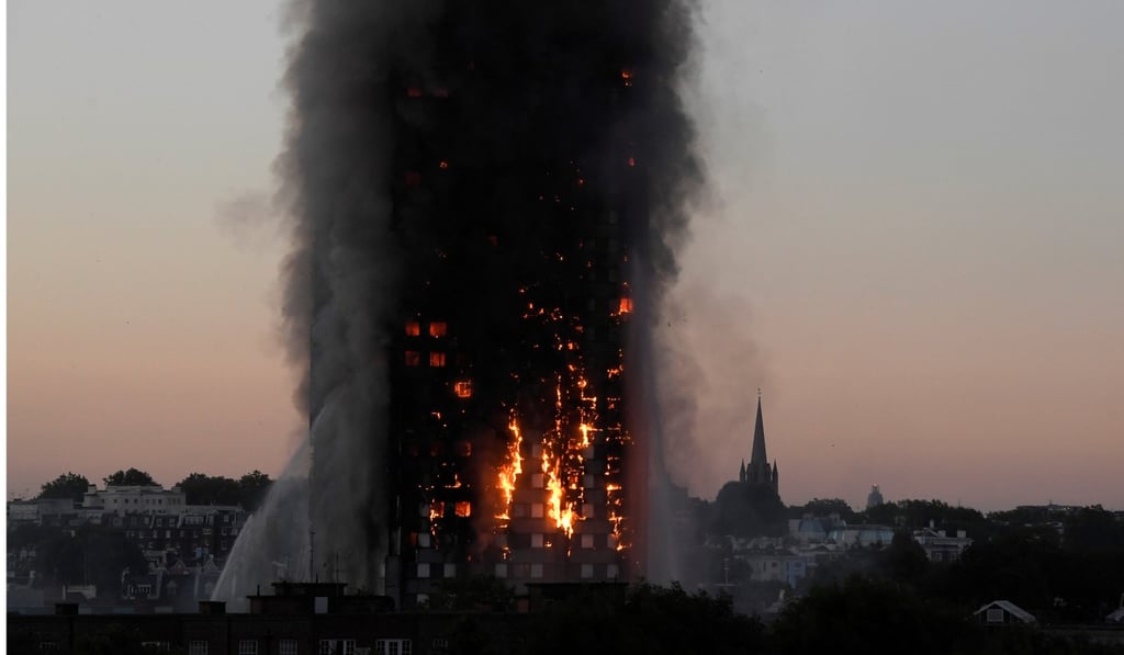 Flames and smoke billow out of Grenfell Tower earlier this week. At least 30 people are confirmed dead. Photo: Reuters