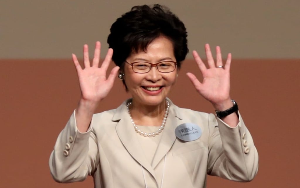 Carrie Lam celebrates on stage after winning the Hong Kong chief executive election. Photo: Robert Ng