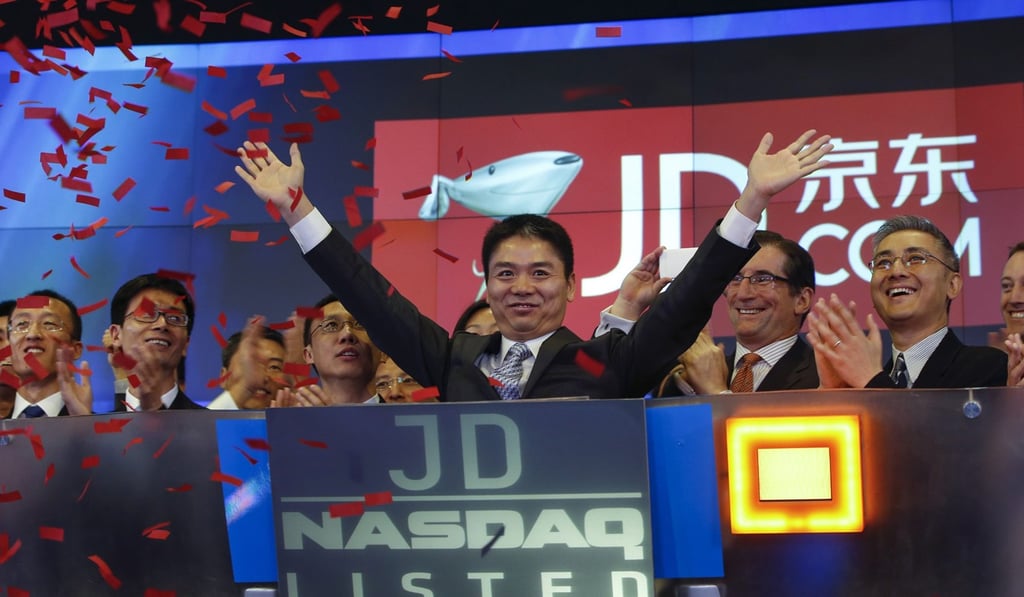 Richard Liu raises his hands after the opening bell at the Nasdaq at Times Square in New York in May 2014. Photo: Reuters