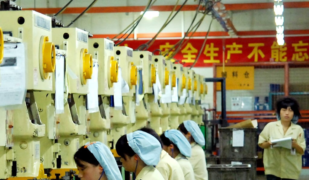Workers produce various components at the Mansfield Manufacturing plant in Dongguan, Guangdong province. Photo: AFP