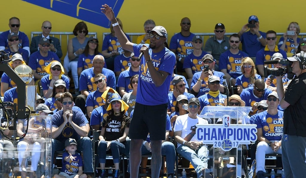 Kevin Durant of the Golden State Warriors talks to the fans while they celebrate the 2017 NBA Championship at The Henry J. Kaiser Convention Centre during their victory parade and rally in Oakland. Photo: AFP Kevin Durant of the Golden State Warriors talks to the fans while they celebrate the 2017 NBA Championship at The Henry J. Kaiser Convention Centre during their victory parade and rally in Oakland. Photo: AFP