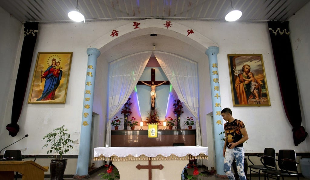 In this July 30, 2015, file photo, a parishioner walks past the altar of the Lower Dafei Catholic Church in Wenzhou. Photo: AP
