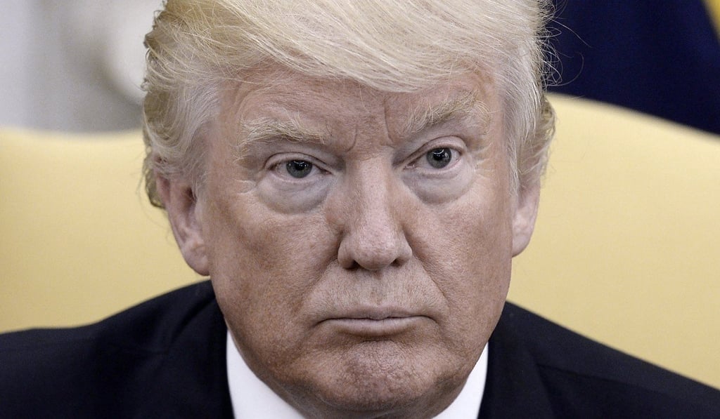 US President Donald J. Trump listens during a meeting with Ukrainian President Petro Poroshenko (not pictured) in the Oval Office of the White House in Washington, DC, on June 20, 2017. Poroshenko discussed security, political and economic issues with Trump. Photo: EPA
