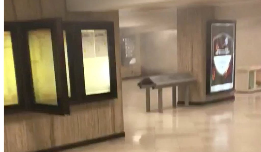 A still image from video shows smoke at Brussels central station in Brussels after the explosions. Photo: Twitter/@Sandormoors