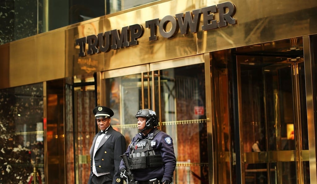 A counter terrorism officer stands in front of Trump Tower in Manhattan. The building, including Trump’s penthouse apartment, is now valued at US$450 million. Photo: AFP