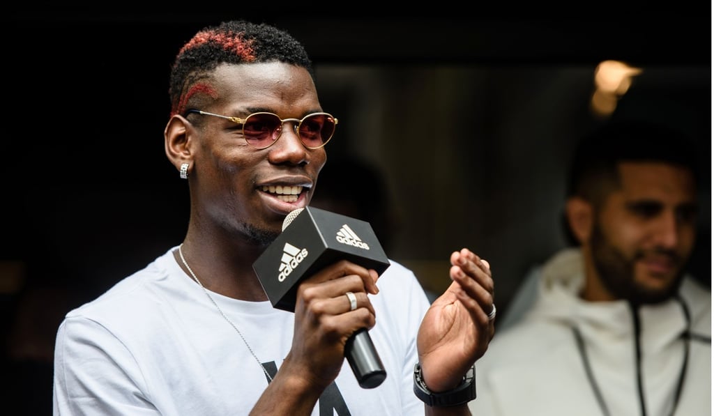 Paul Pogba speaks to fans. Photo: AFP