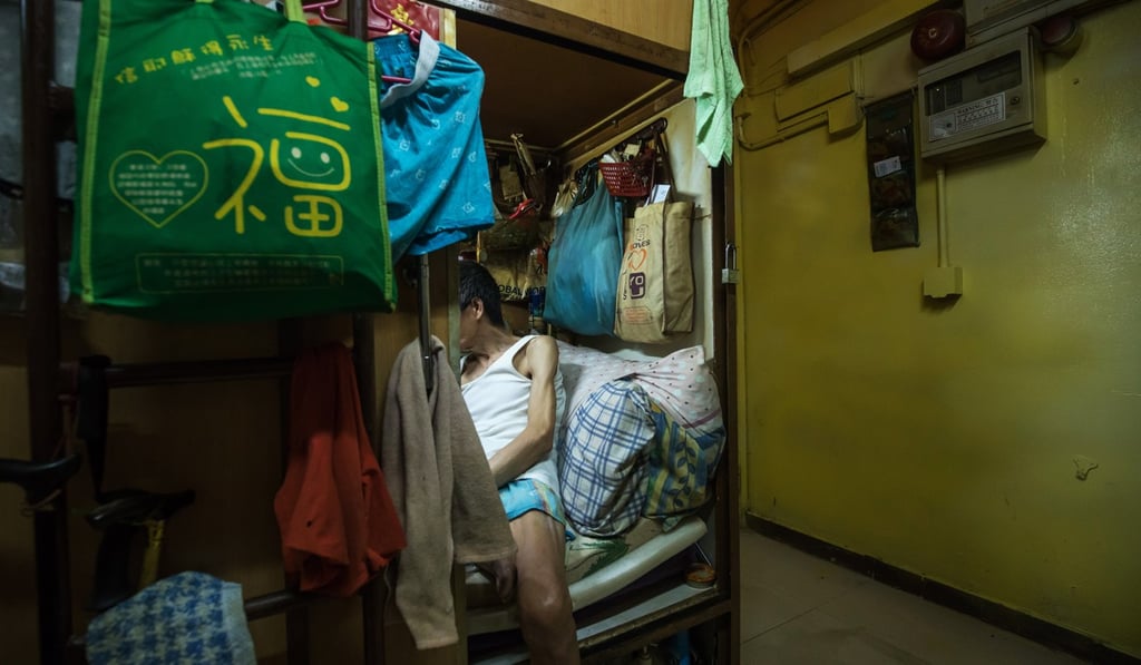 A man sits inside his “coffin home” in a subdivided flat in Hong Kong. The city’s Gini coefficient, which measures its income disparity, has climbed to a record high. Likewise, housing prices have become severely unaffordable. Photo: Bloomberg A man sits inside his “coffin home” in a subdivided flat in Hong Kong. The city’s Gini coefficient, which measures its income disparity, has climbed to a record high. Likewise, housing prices have become severely unaffordable. Photo: Bloomberg